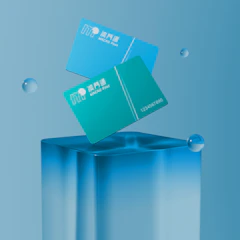 Two cards floating above a glass cube.