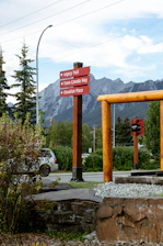 Red signpost directs to legacy trail and trans-canada highway.