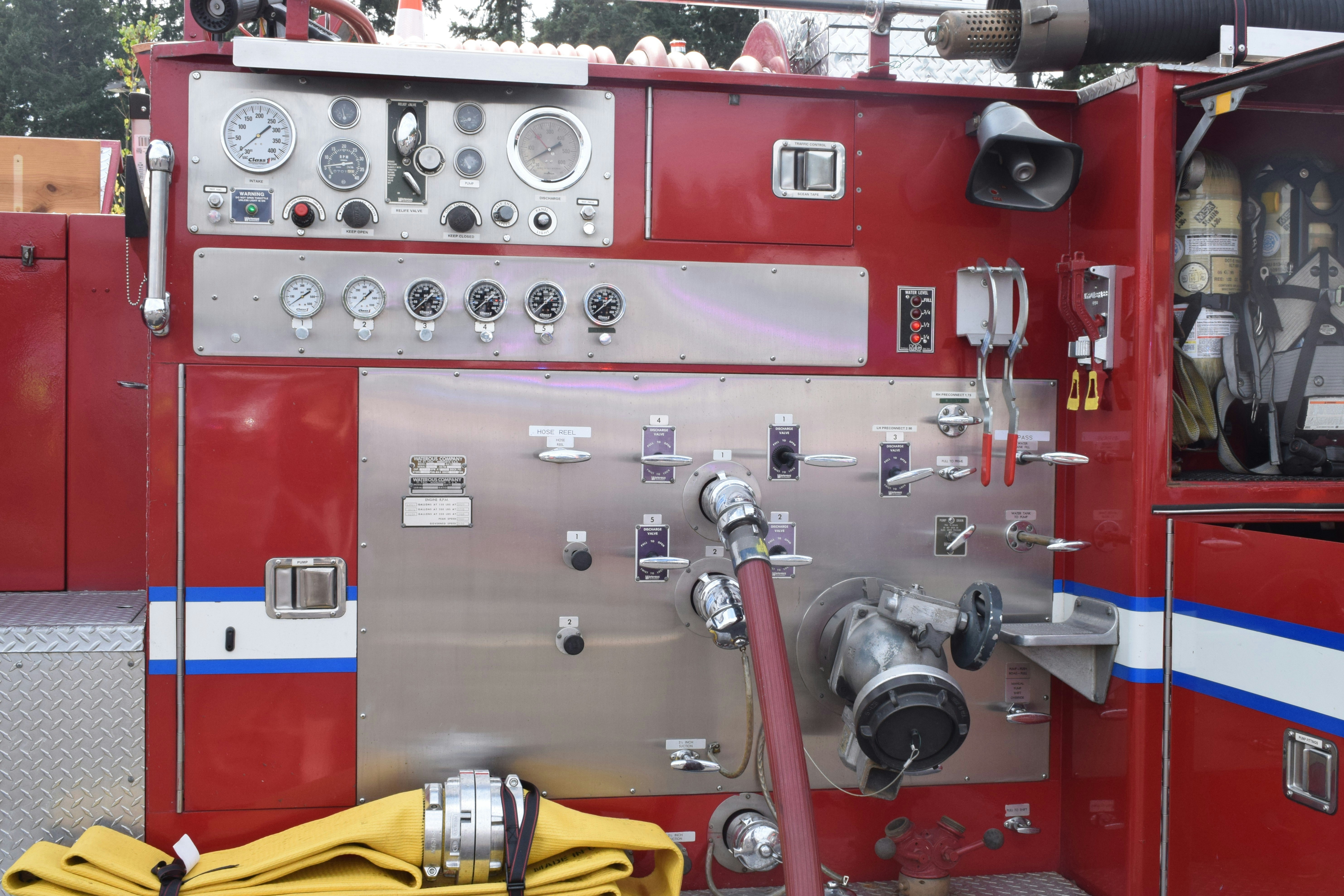 Close-up of a red fire truck control panel.