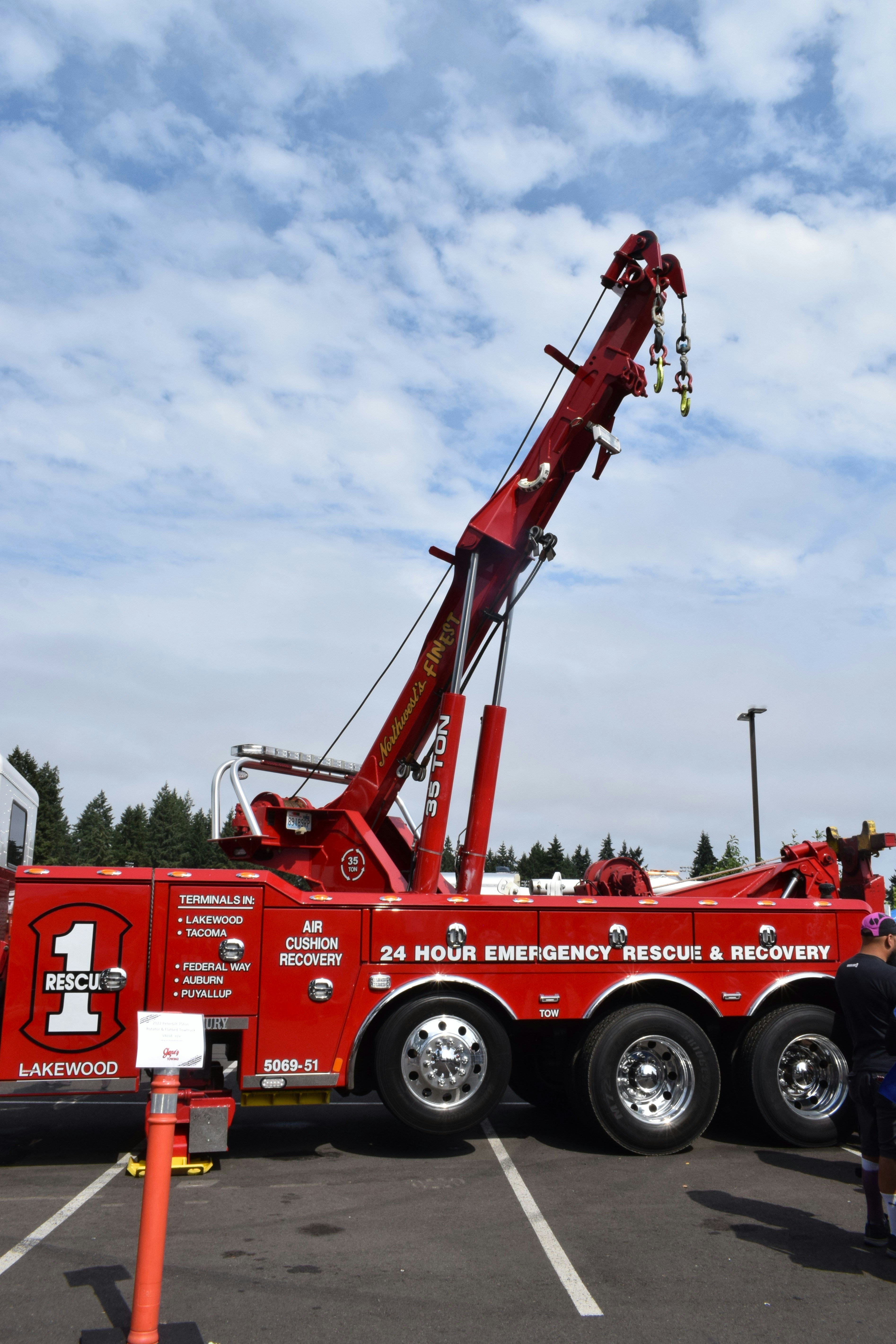 A large red tow truck with emergency rescue lettering.