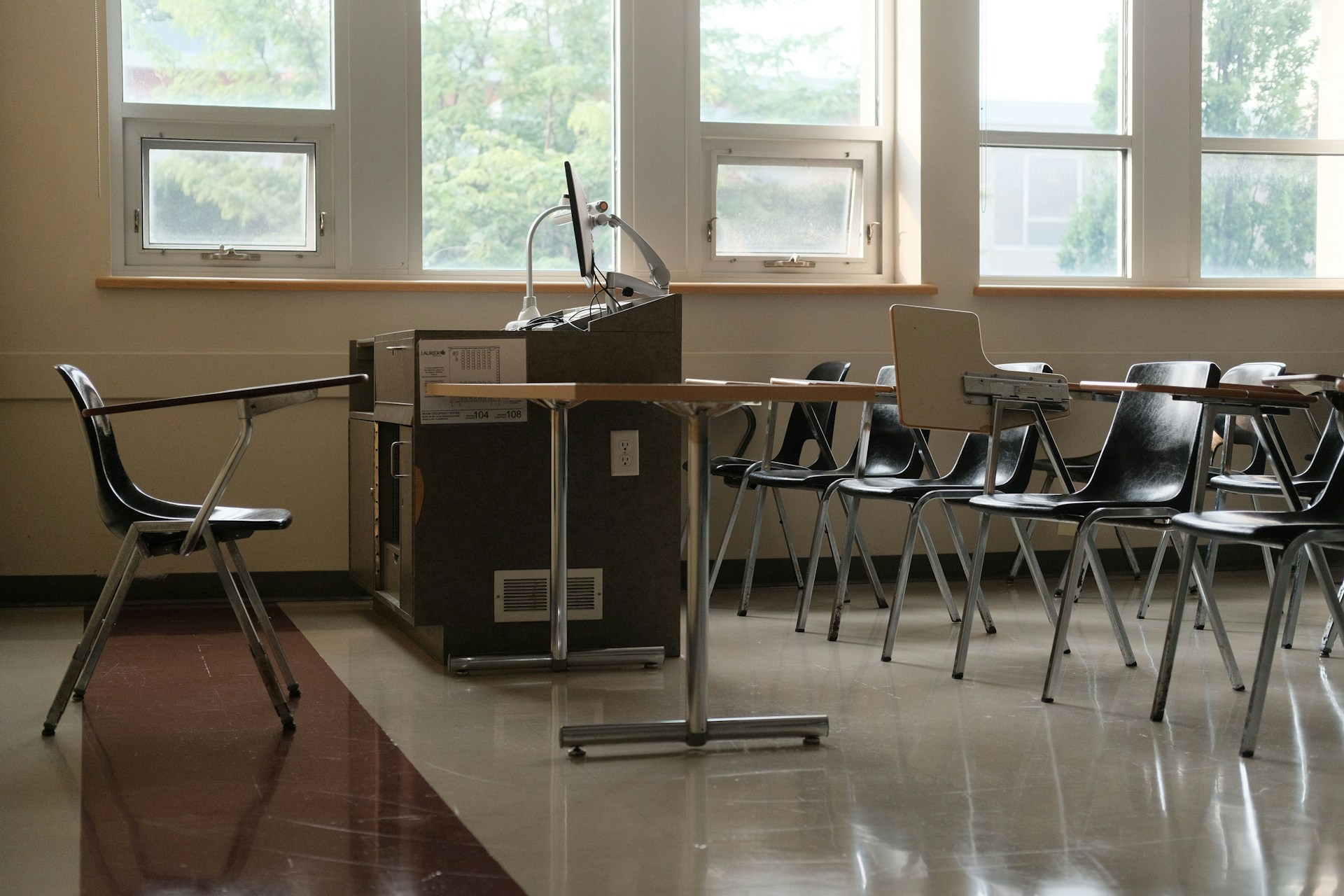 Empty classroom with desks and chairs