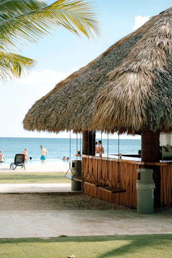 Beach bar with thatched roof and ocean view