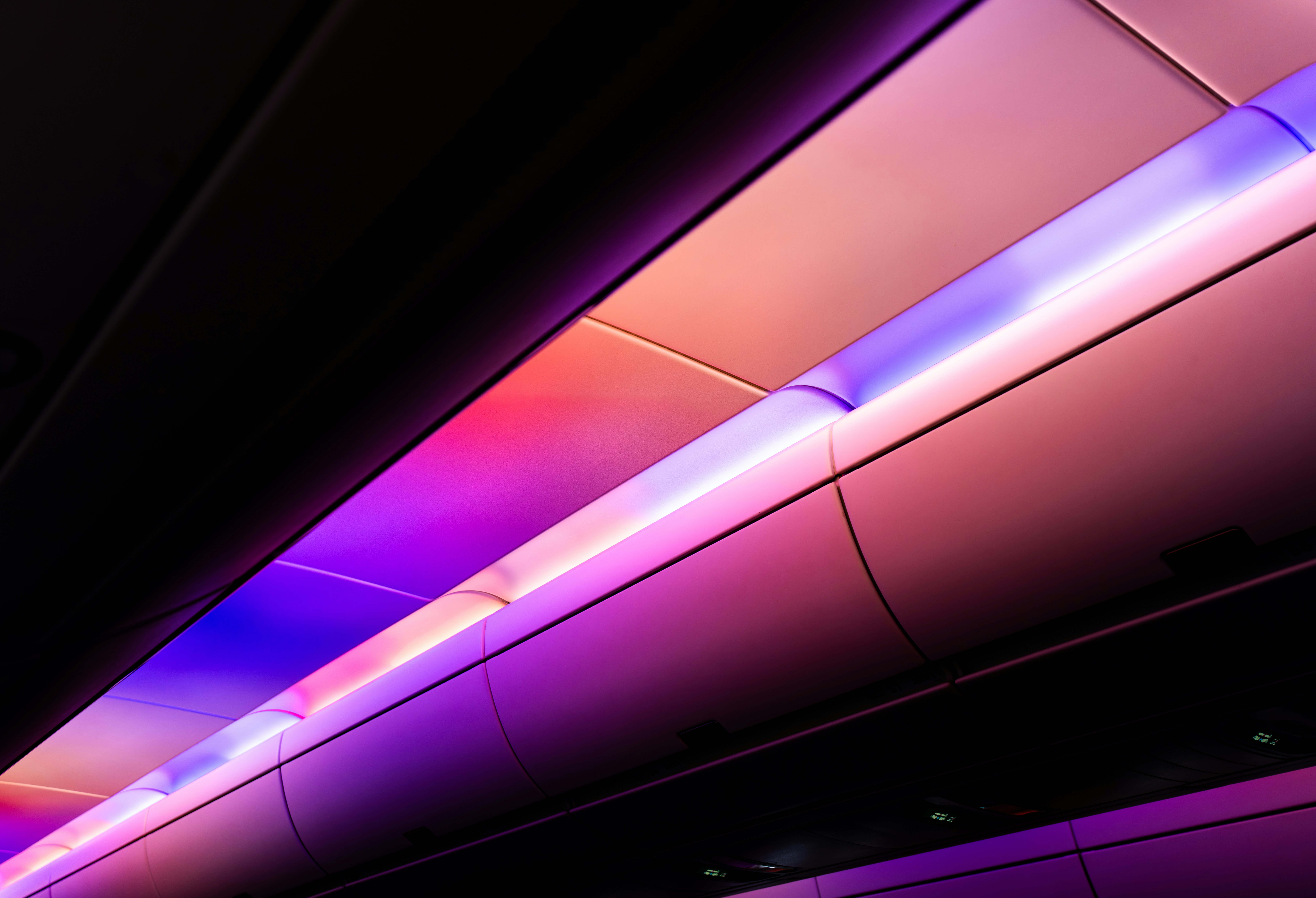 Airplane cabin with colorful ambient lighting