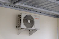 An air conditioning unit mounted on a wall.