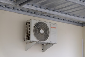 An air conditioning unit mounted on a wall.
