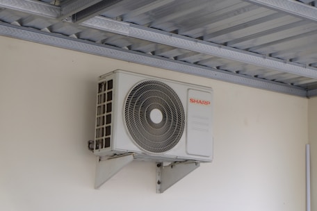An air conditioning unit mounted on a wall.