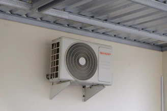 An air conditioning unit mounted on a wall.