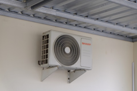 An air conditioning unit mounted on a wall.
