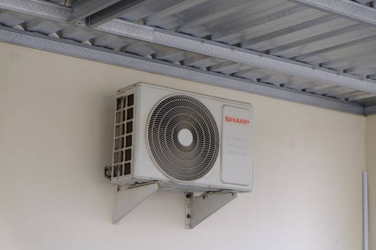 An air conditioning unit mounted on a wall.