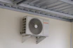 An air conditioning unit mounted on a wall.