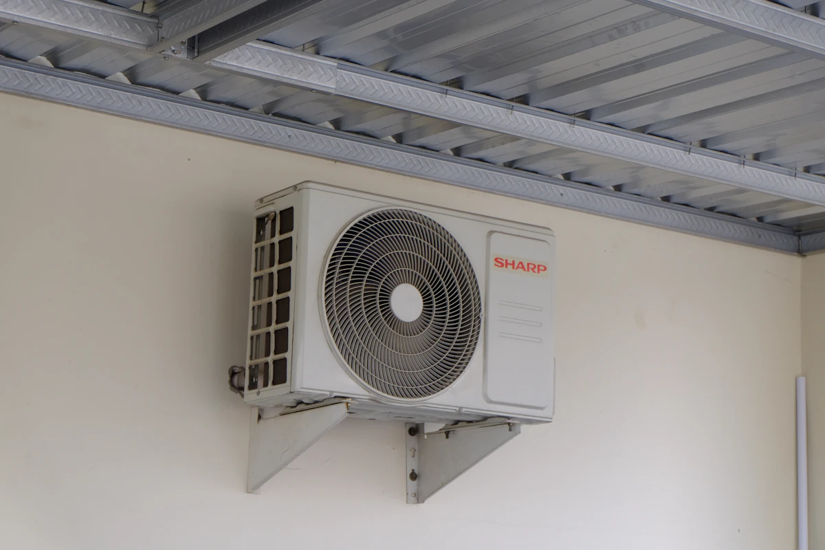 Wall-mounted outdoor unit for a Kerr Village semi with no side-yard clearance