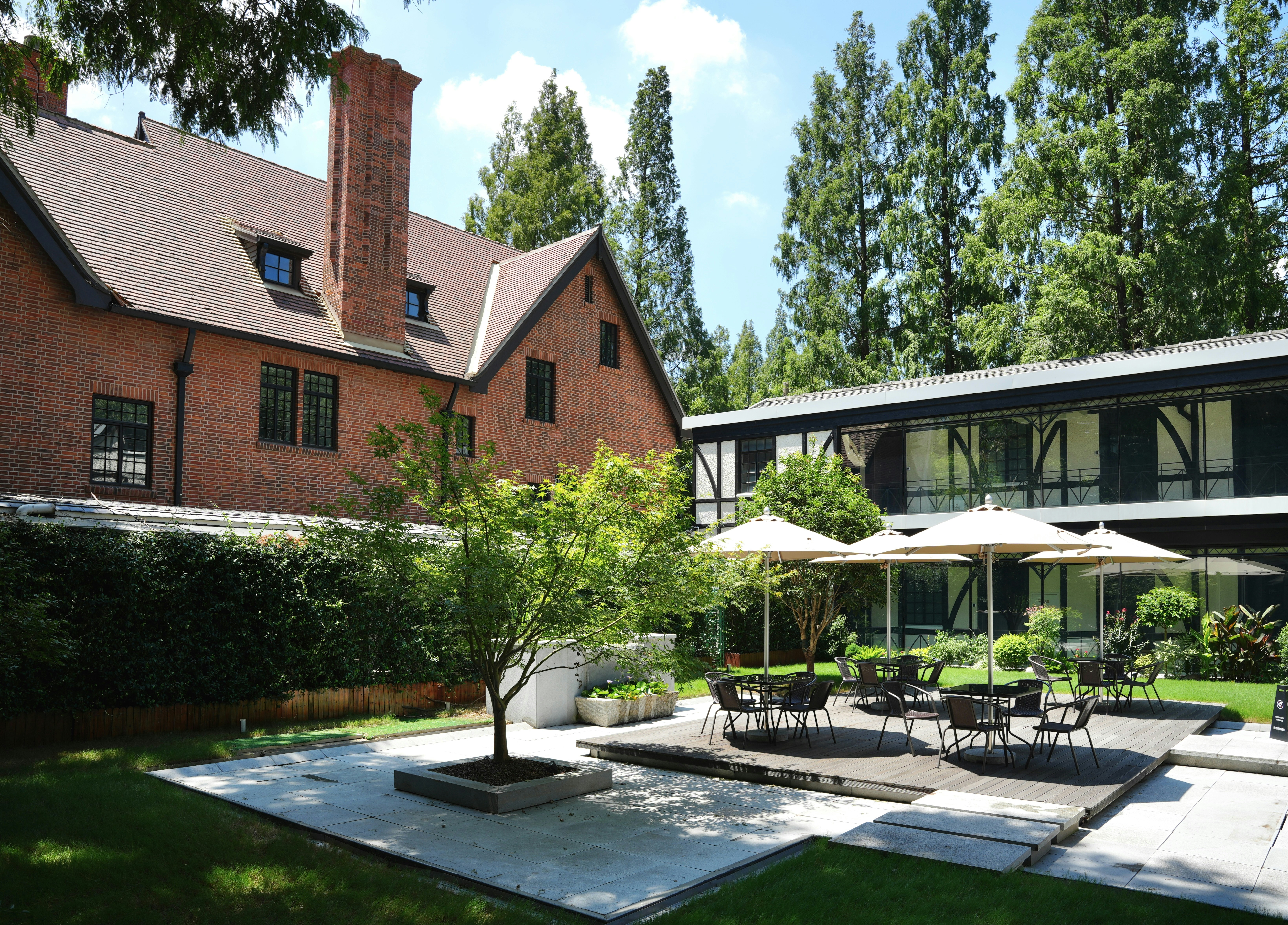 Outdoor seating area next to a brick building