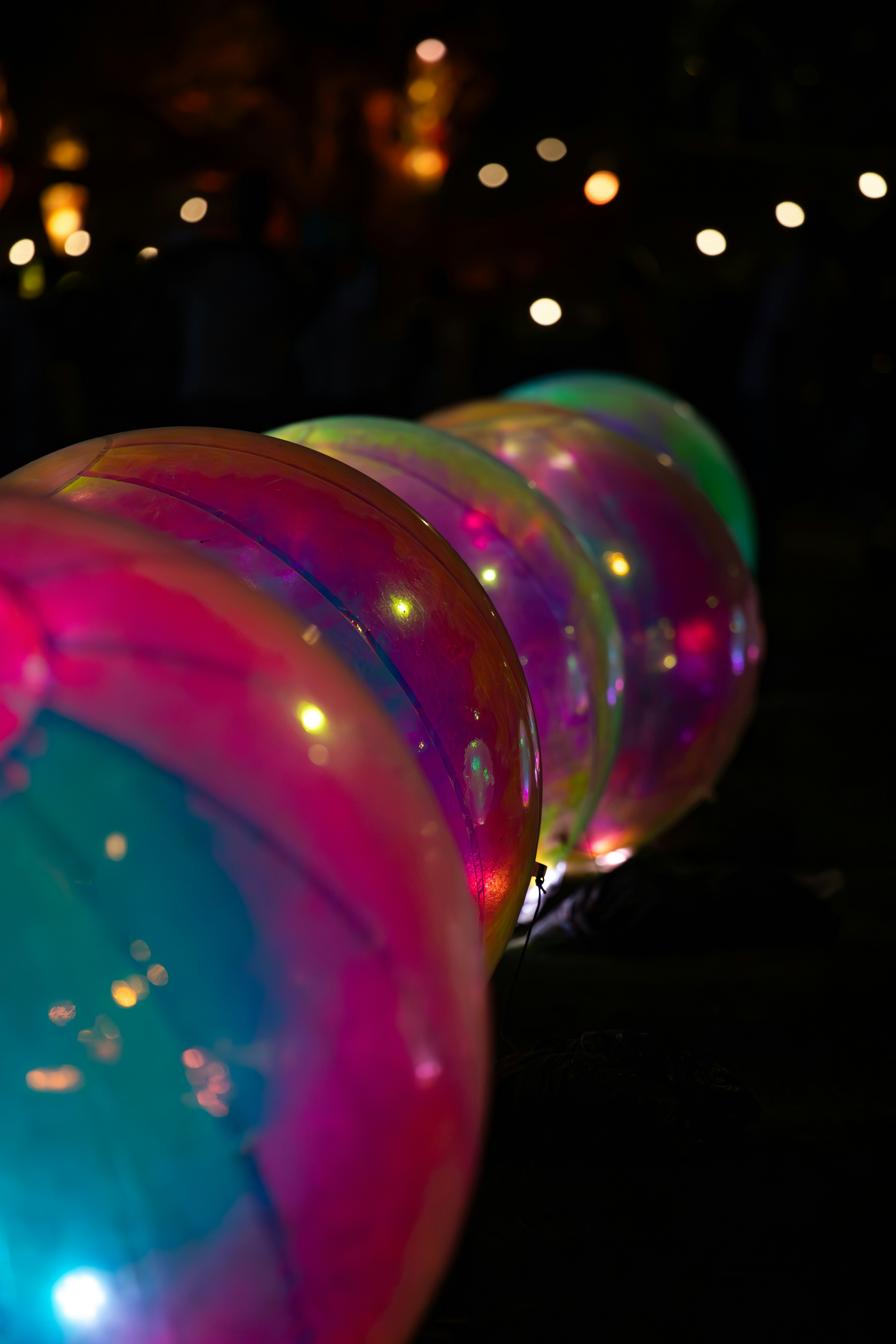 Colorful glowing spheres in a dark setting