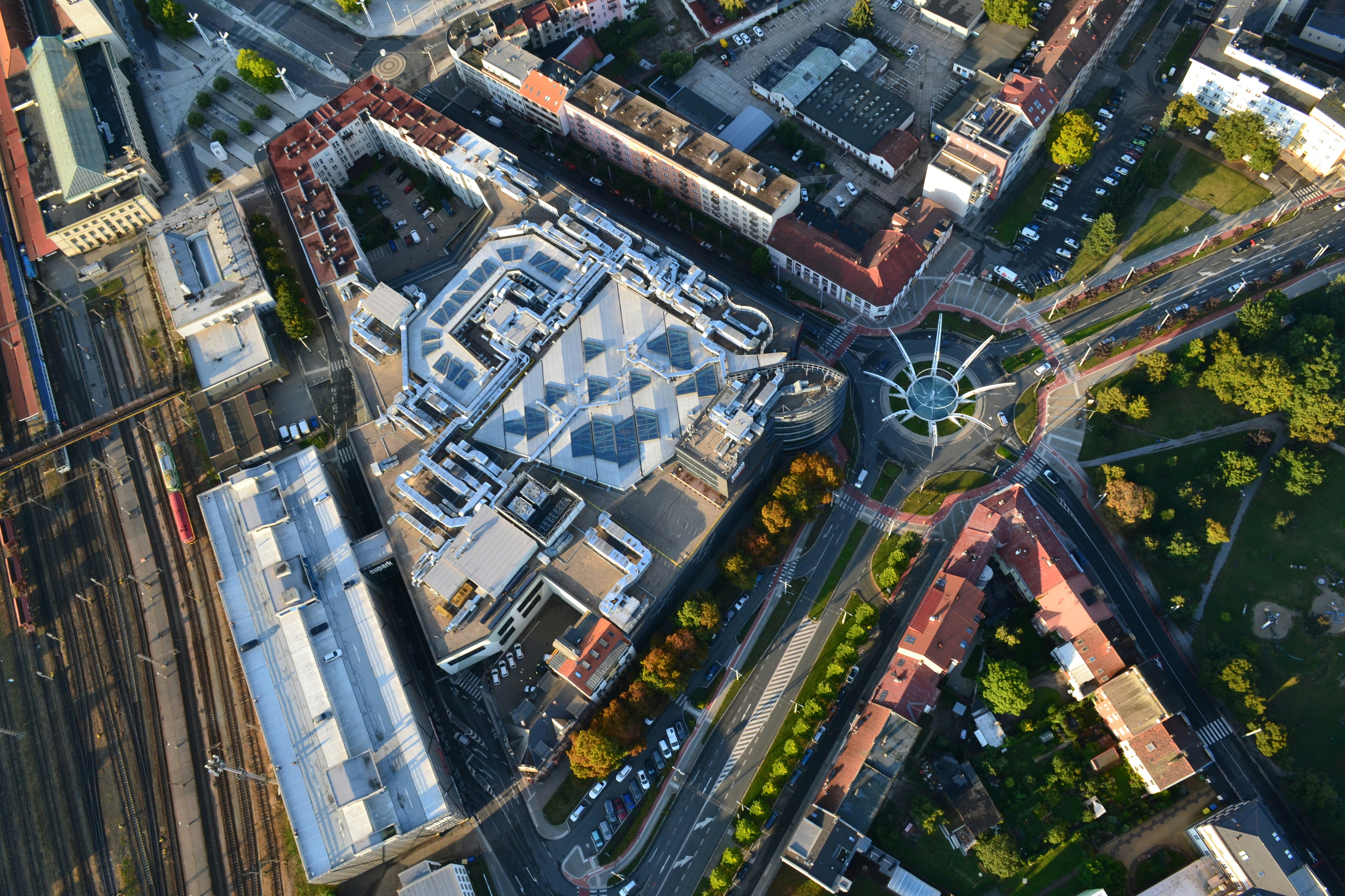 Aerial view of a modern building and city intersection.