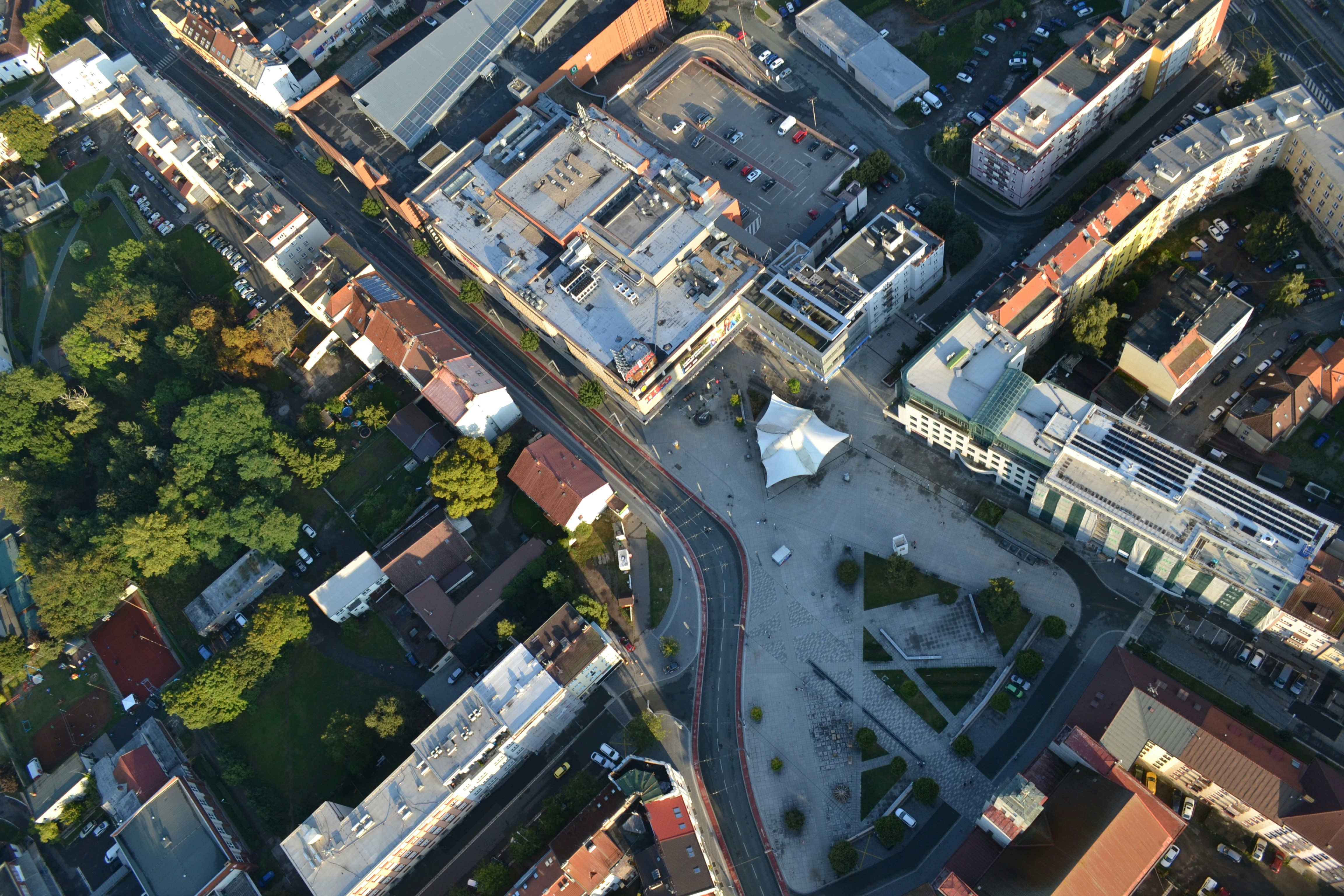 Aerial view of a city square and surrounding buildings