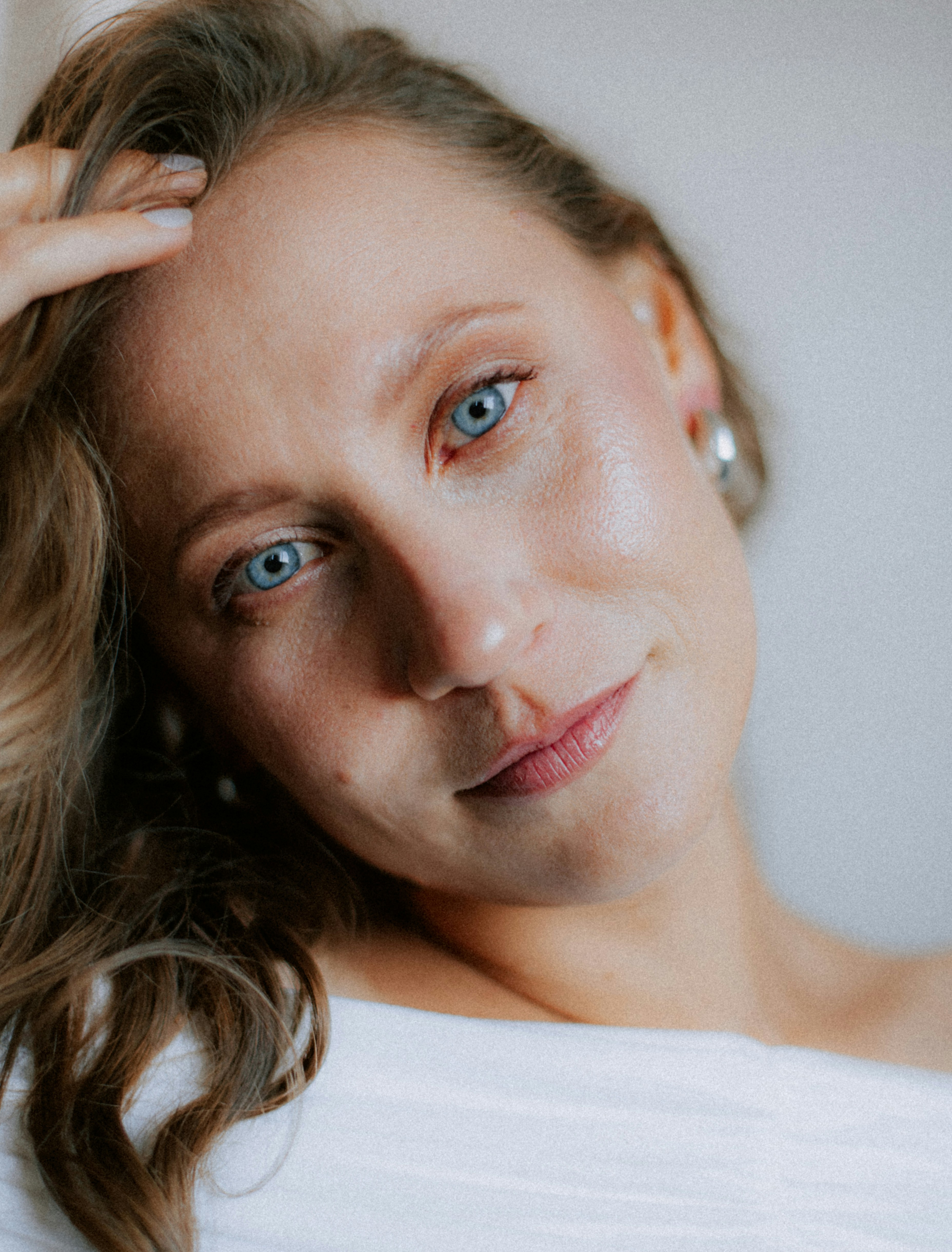 A woman with blue eyes and blonde hair