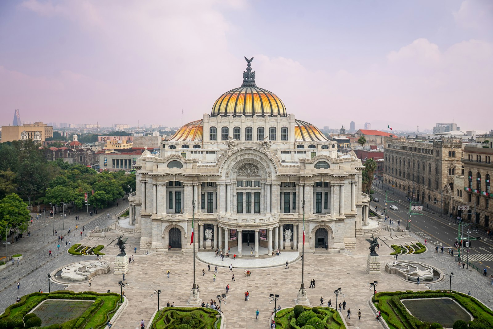 The marble Palacio de Bellas Artes with its golden domes, seen from above, in Mexico City's historic center