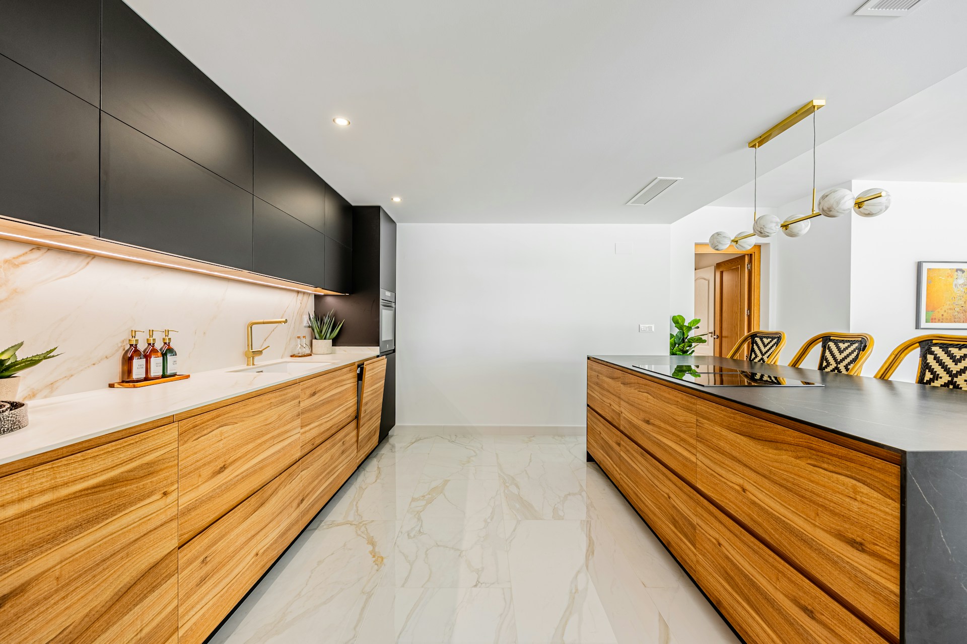 Modern kitchen with wooden cabinets and marble countertops