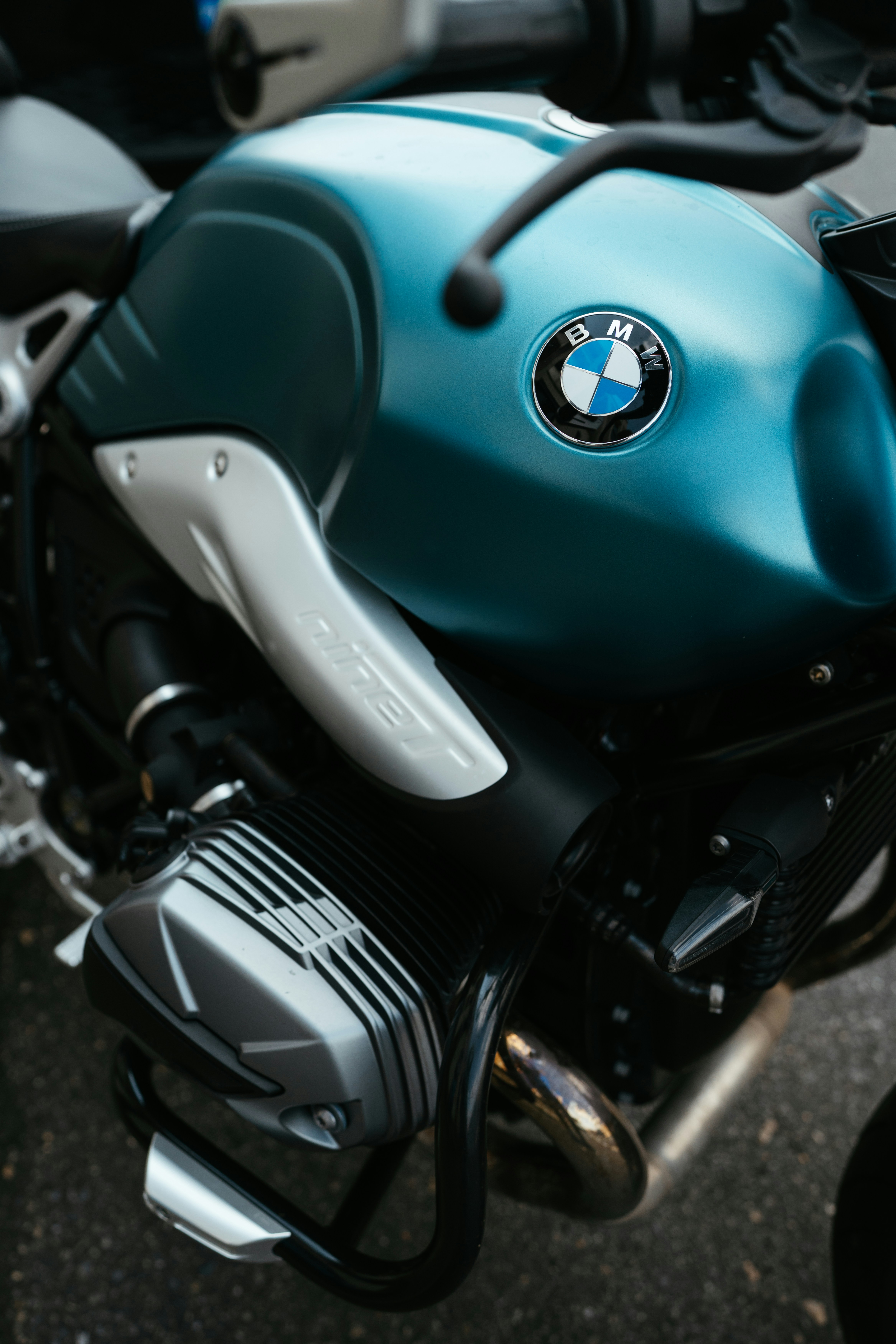 Close-up of a teal BMW motorcycle engine.