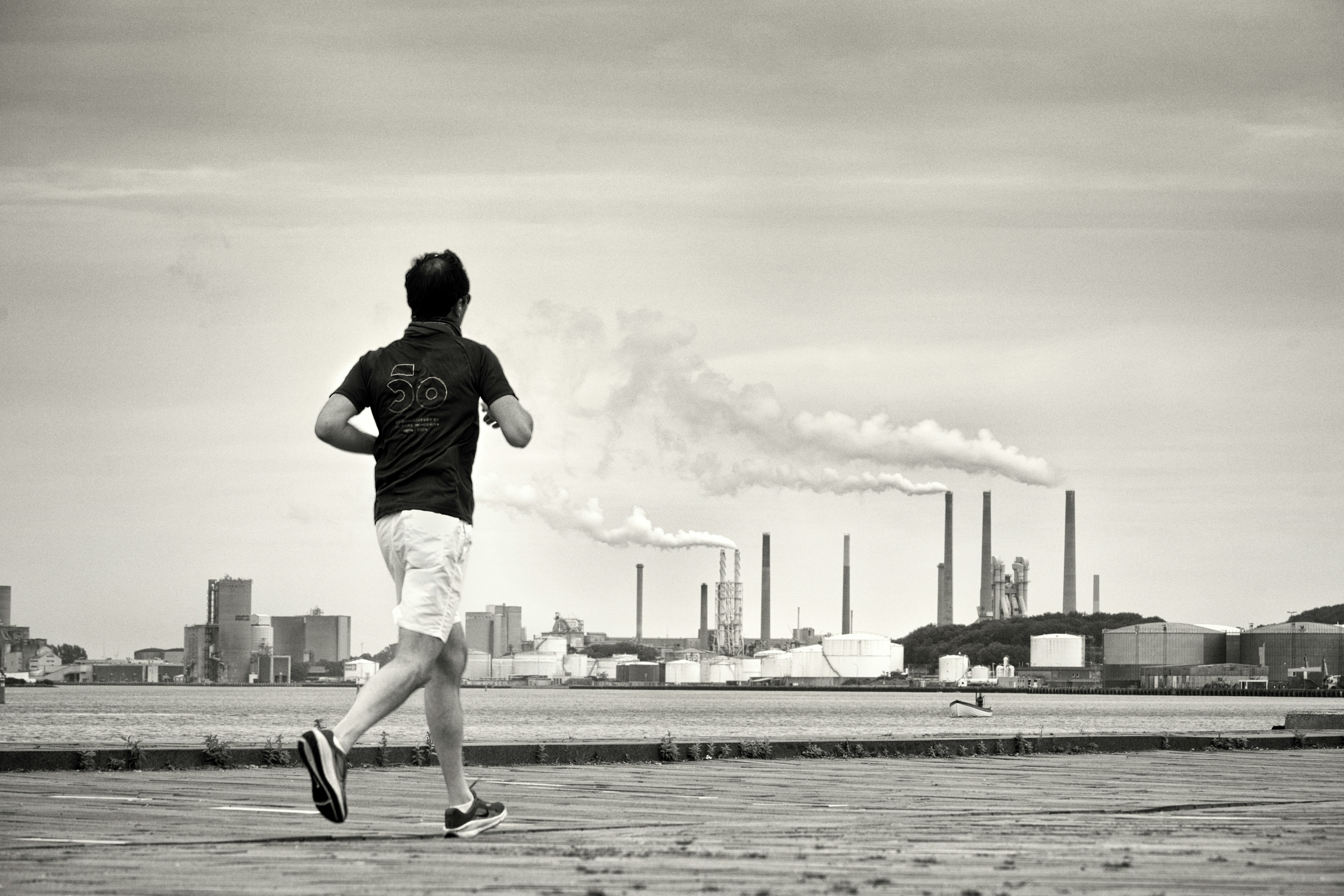Man running with industrial background