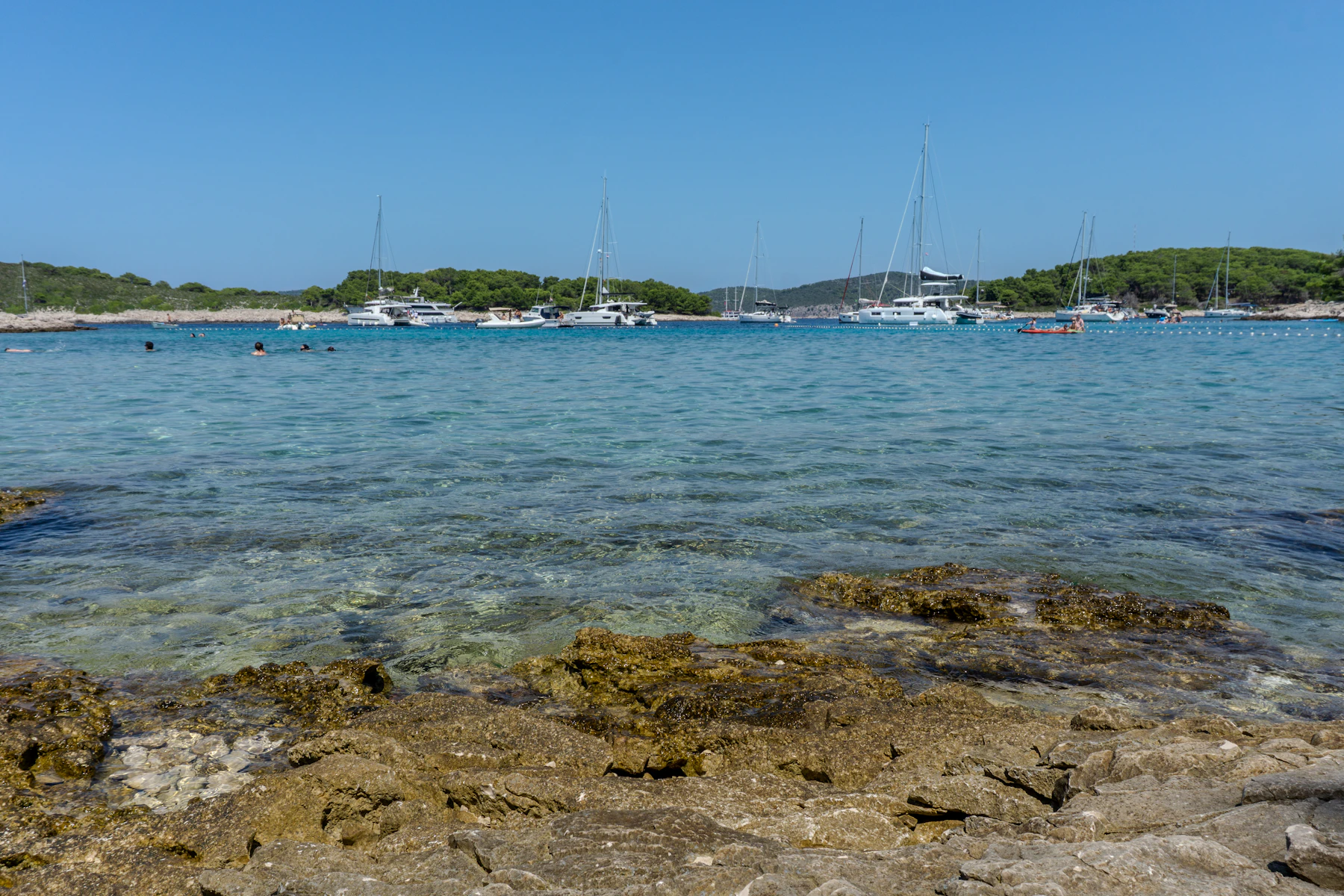 Clear Adriatic bay with boats near Hvar island in Croatia