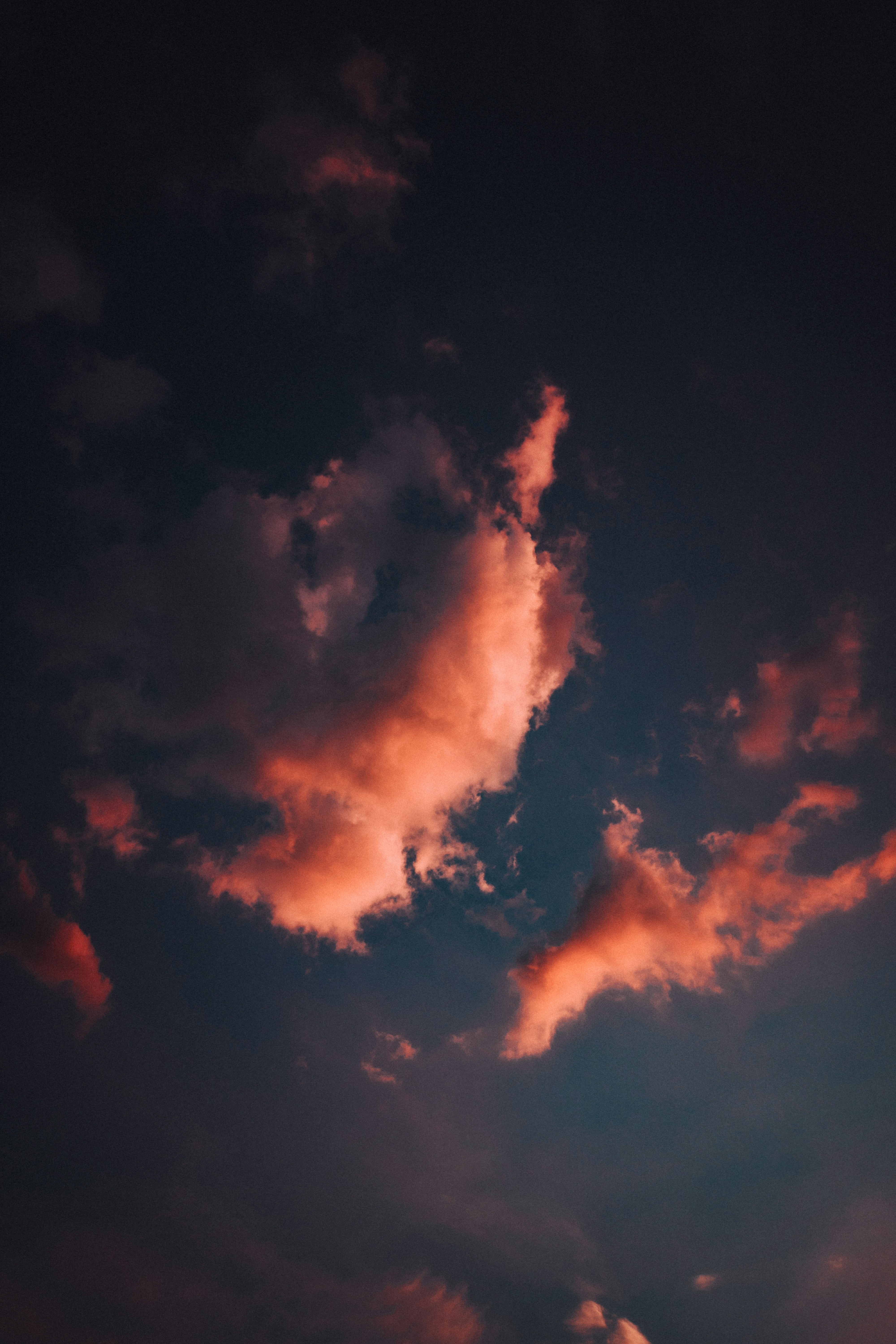 Fiery clouds illuminated against a dark sky