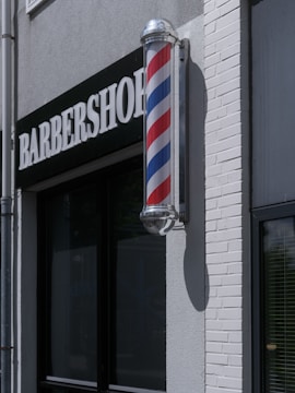 Barbershop sign with a traditional pole