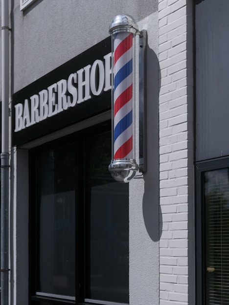 Barbershop sign with a traditional pole