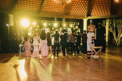 People dancing at a party with a live band
