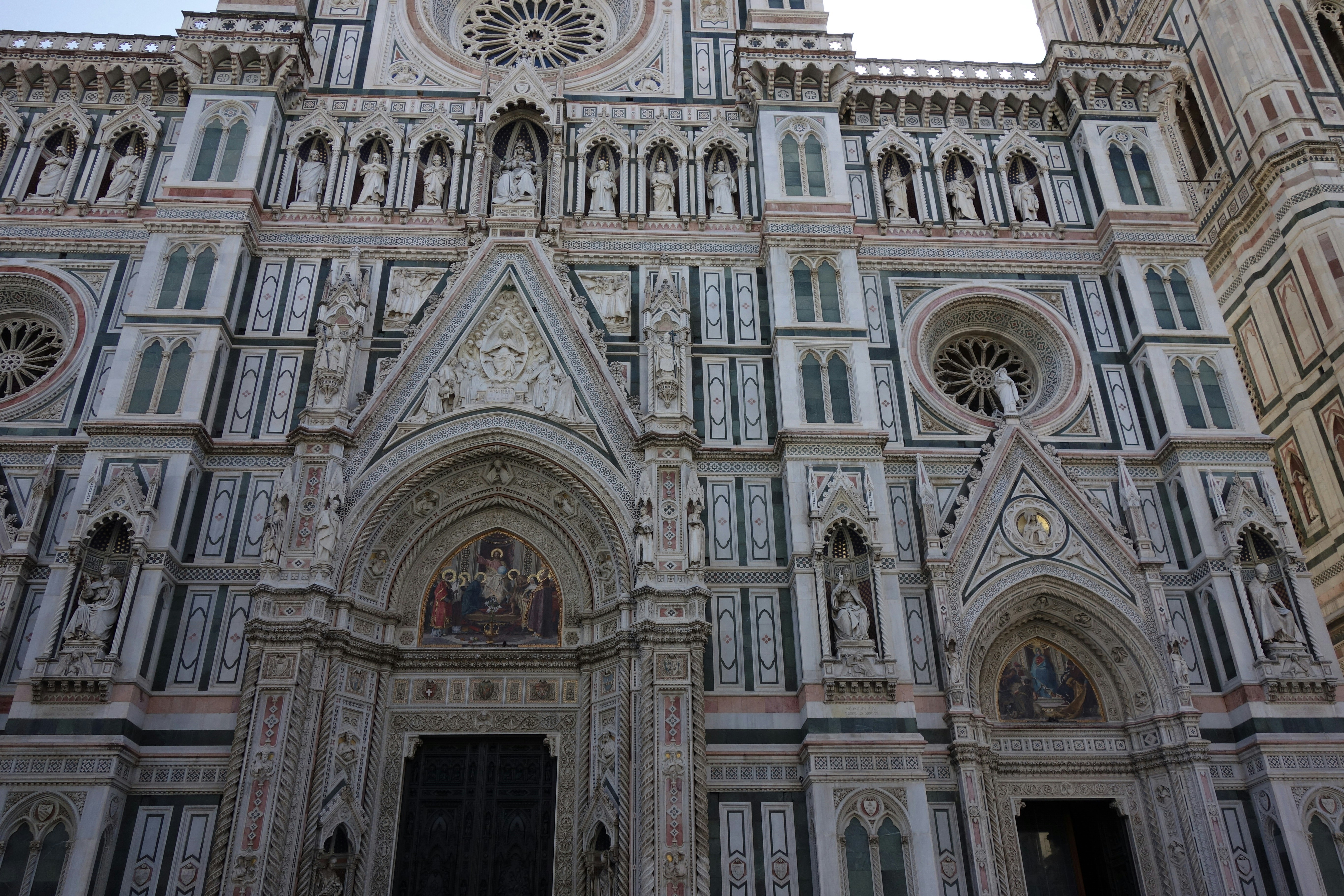 Intricate facade of a grand cathedral with detailed stonework.