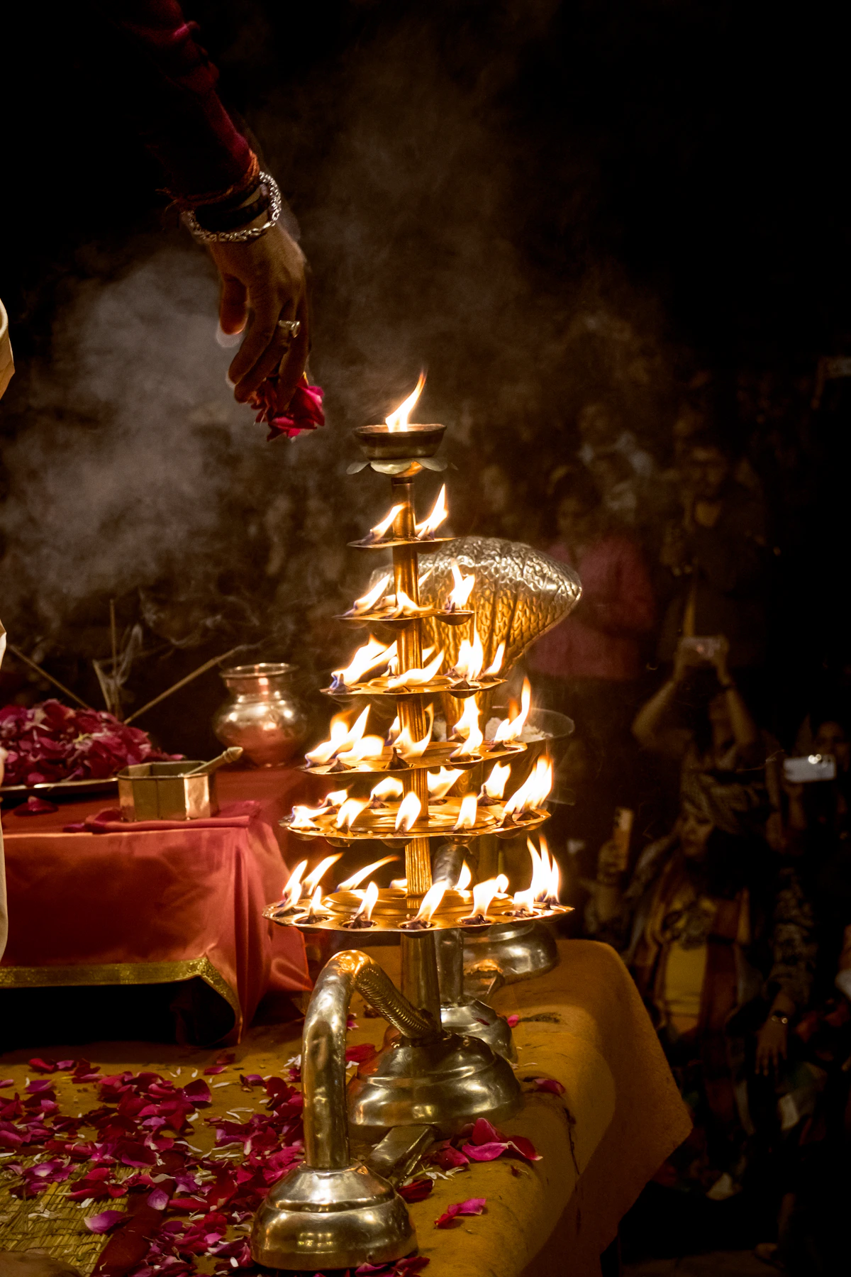 How to book puja with Savidhi — brass aarti lamp at Ganga Ghat, Varanasi