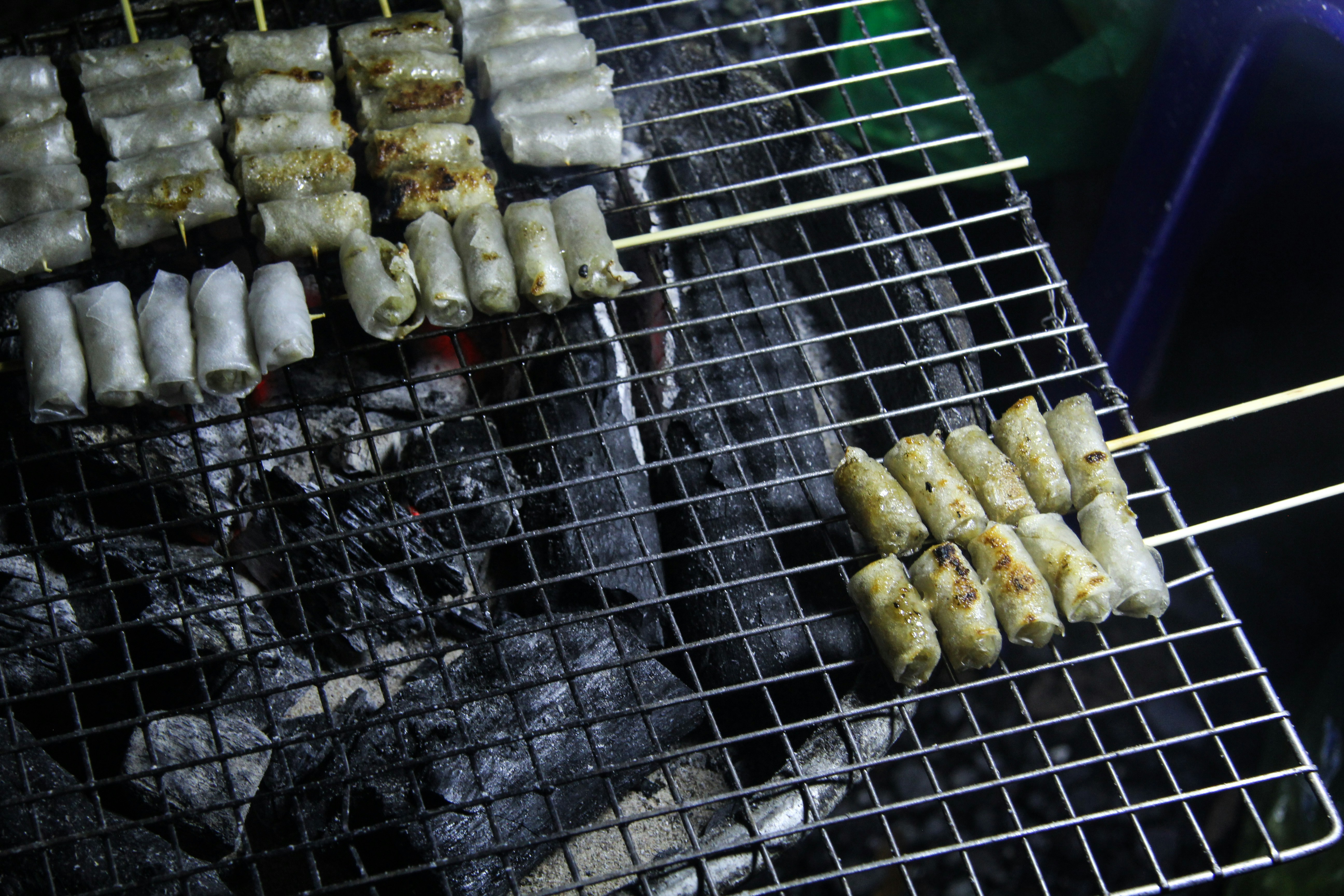 Spring rolls grilling on a barbecue
