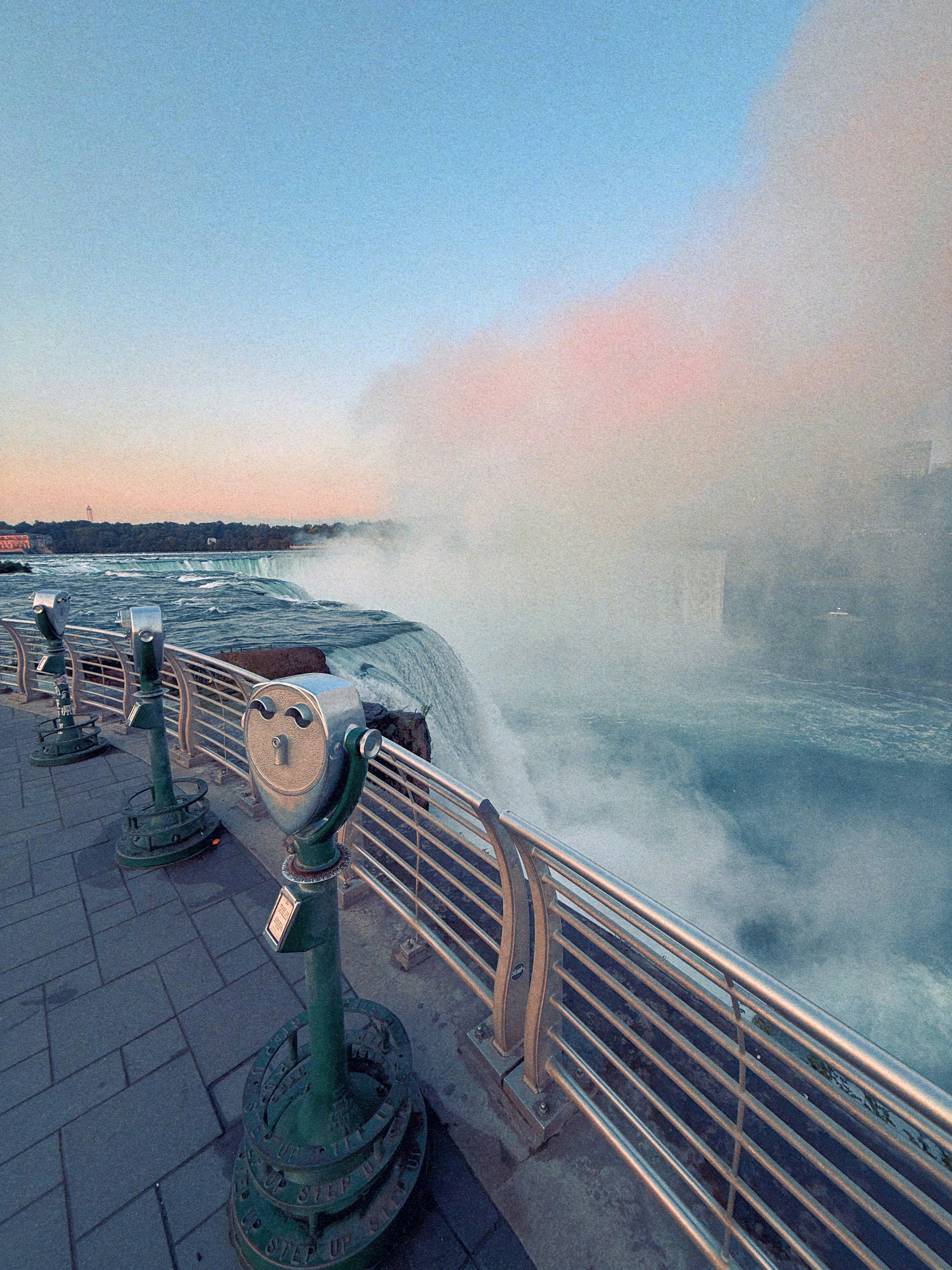 Niagara falls with viewing binoculars at sunset
