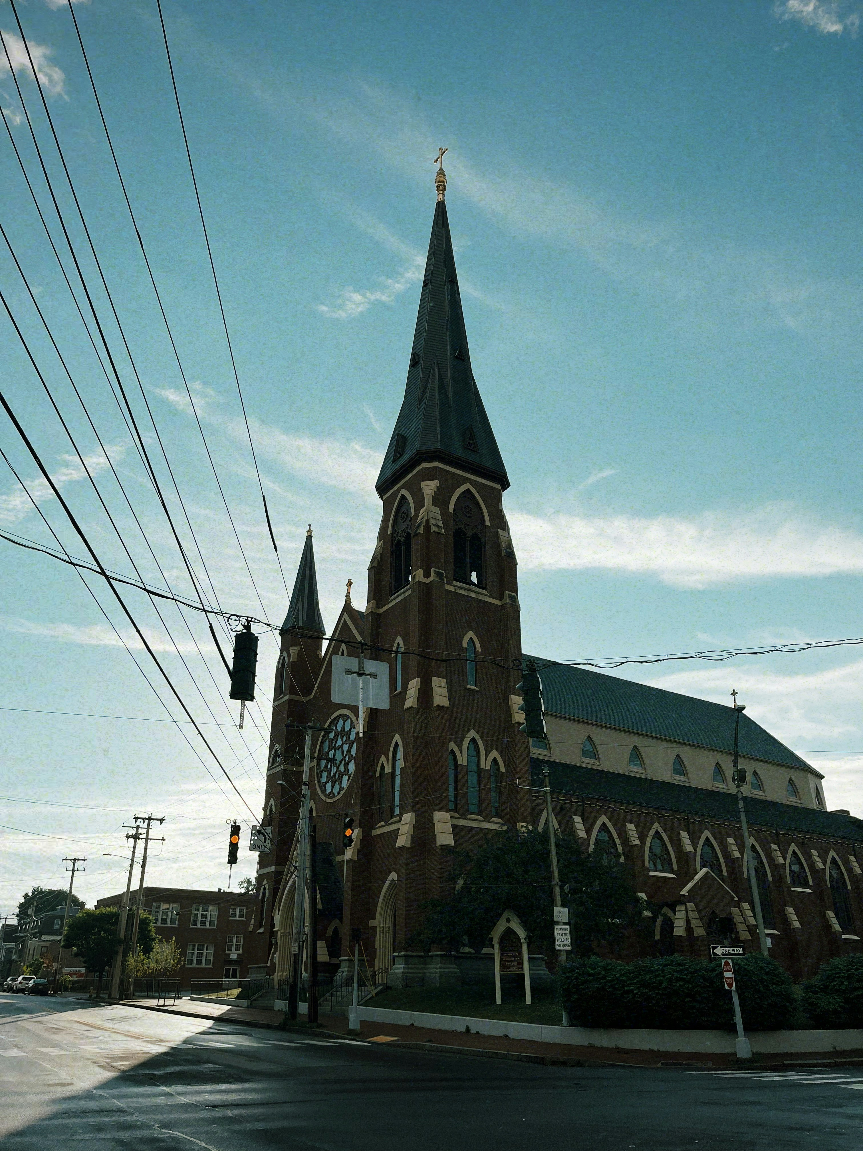 Gothic church with tall spires against a blue sky