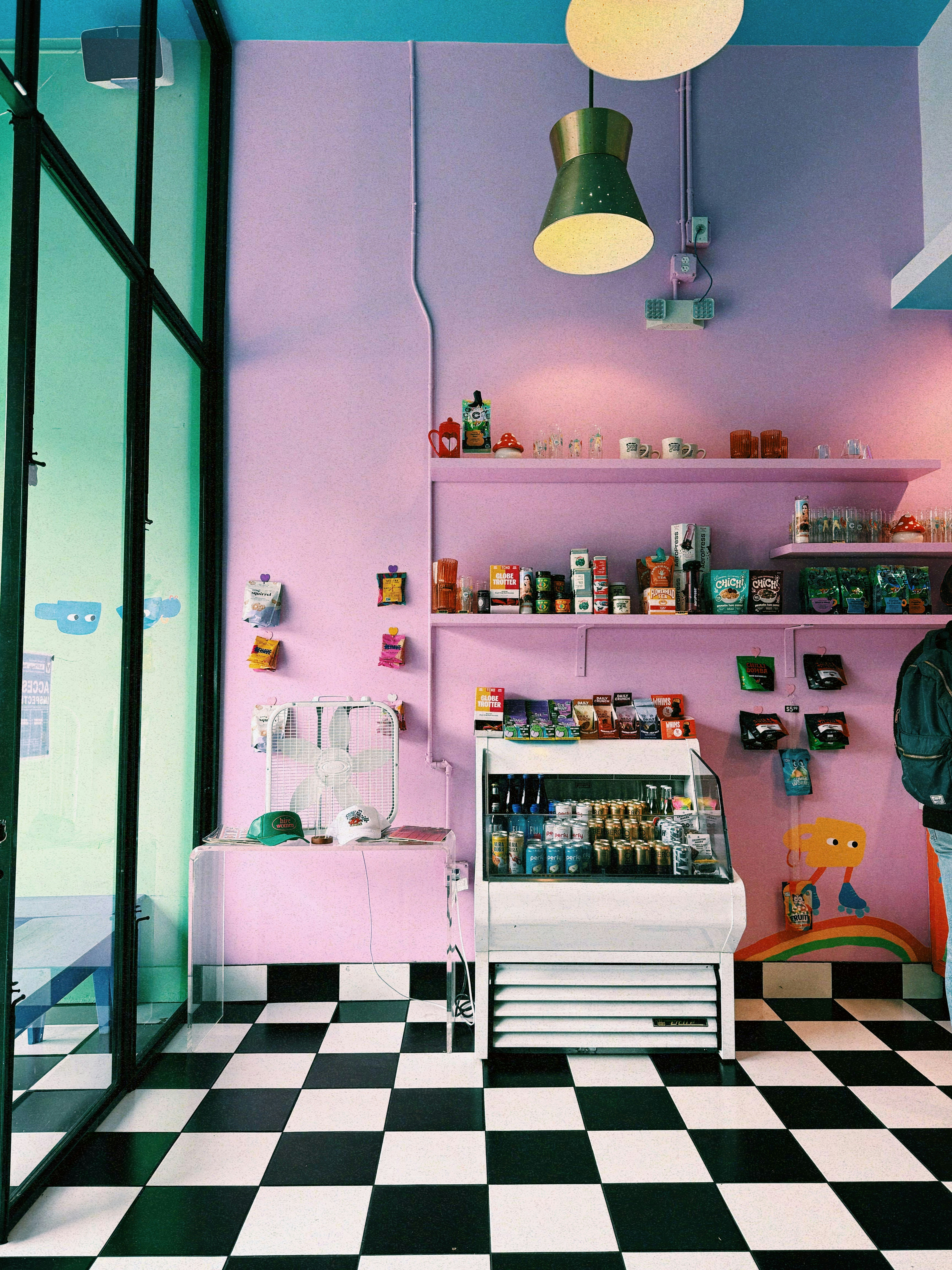A pink shop interior with a checkered floor