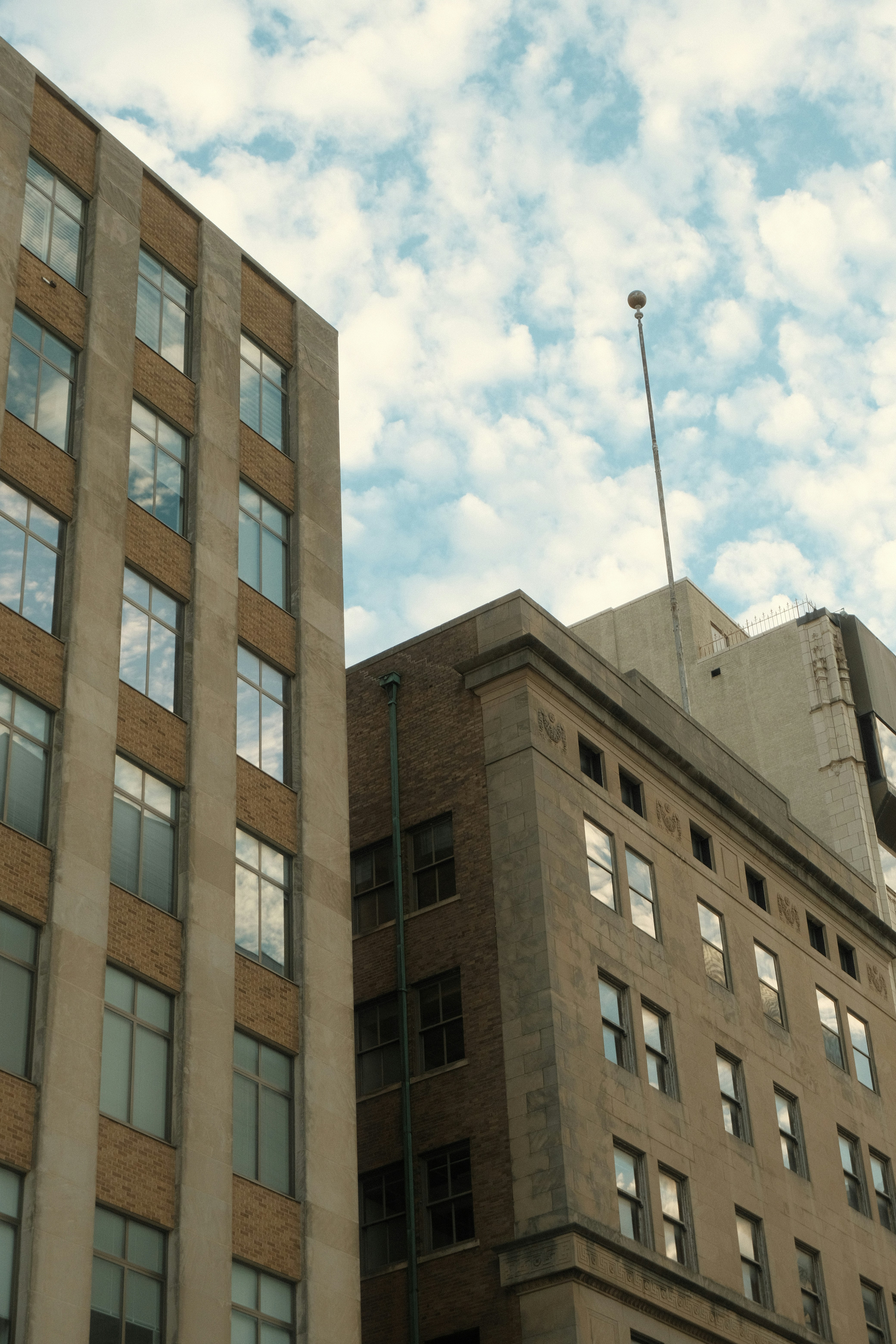 Tall buildings against a cloudy sky