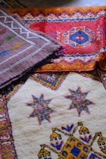 Colorful woven rugs with intricate geometric patterns