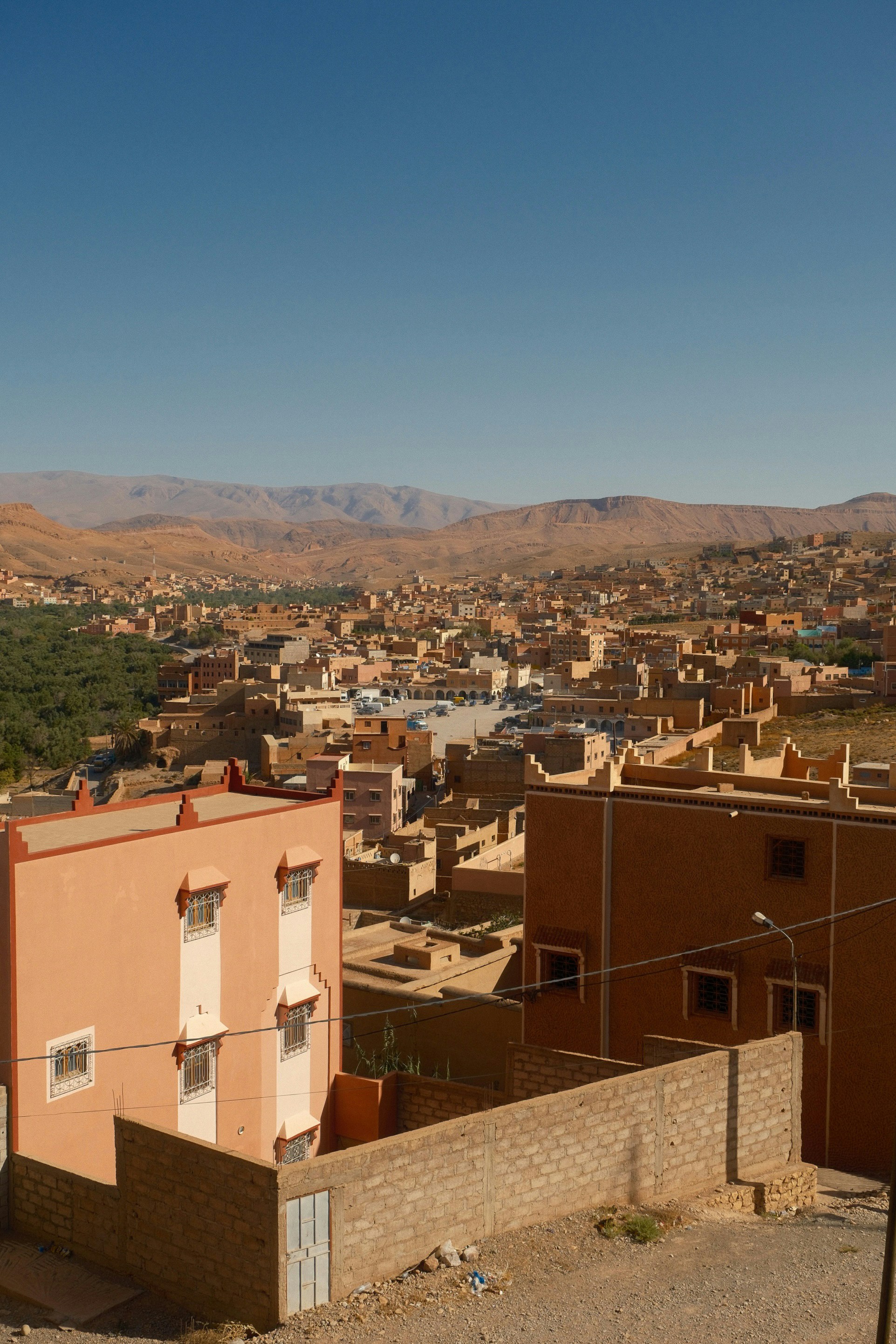 Desert town with buildings and distant mountains