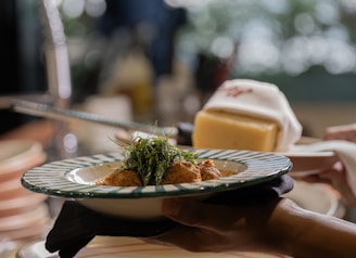 A delicious meal is served on a plate with garnishes.