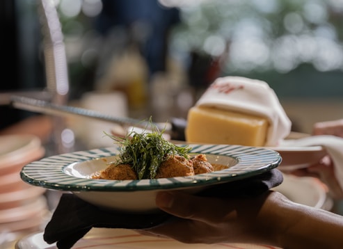 A delicious meal is served on a plate with garnishes.