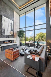 Modern living room with large windows and fireplace