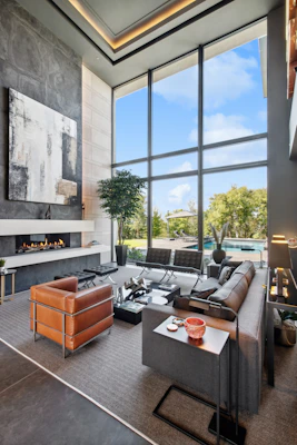 Modern living room with large windows and fireplace