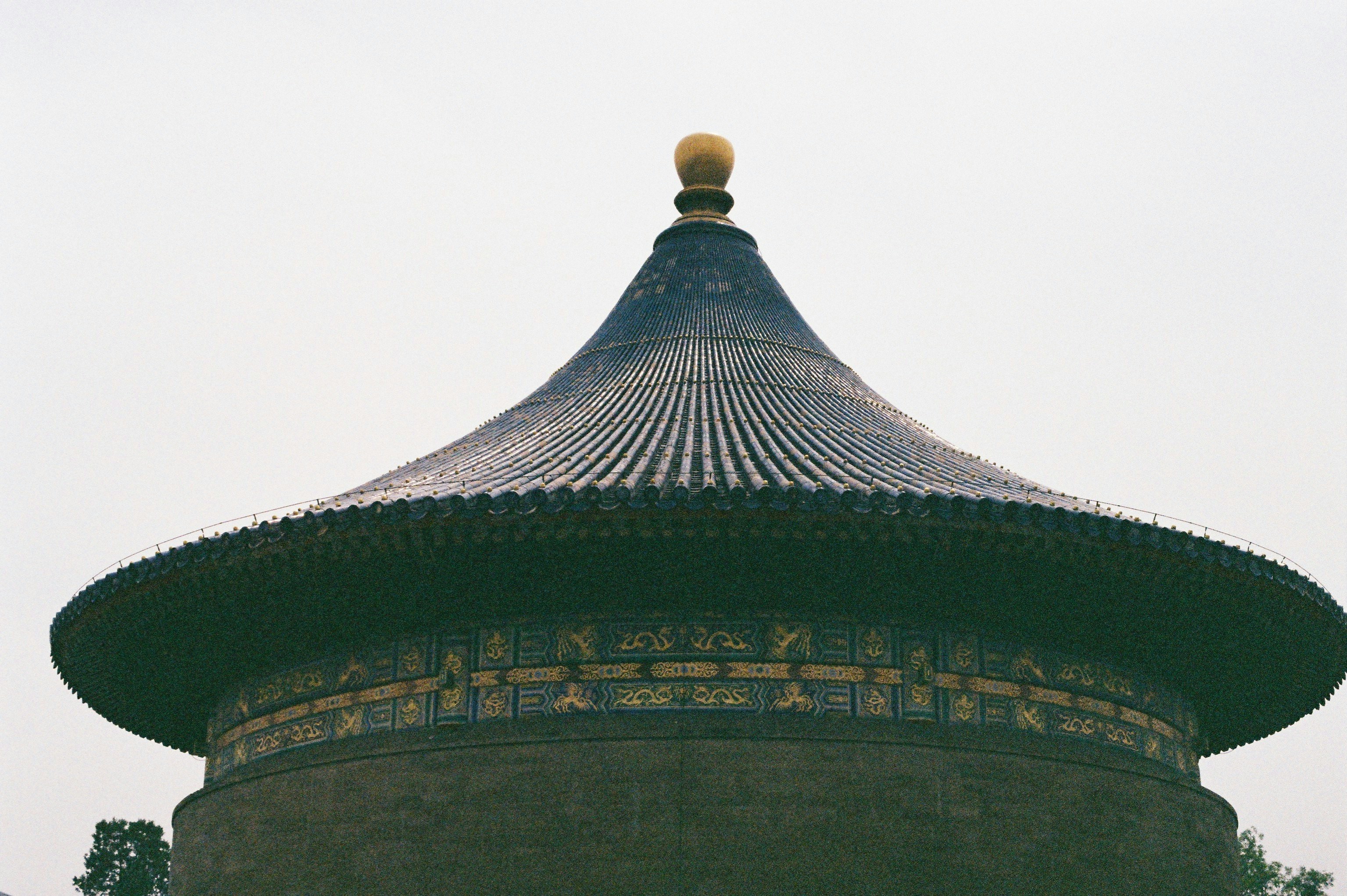 Traditional chinese temple roof with golden orb
