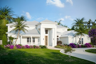 A modern white house with lush landscaping