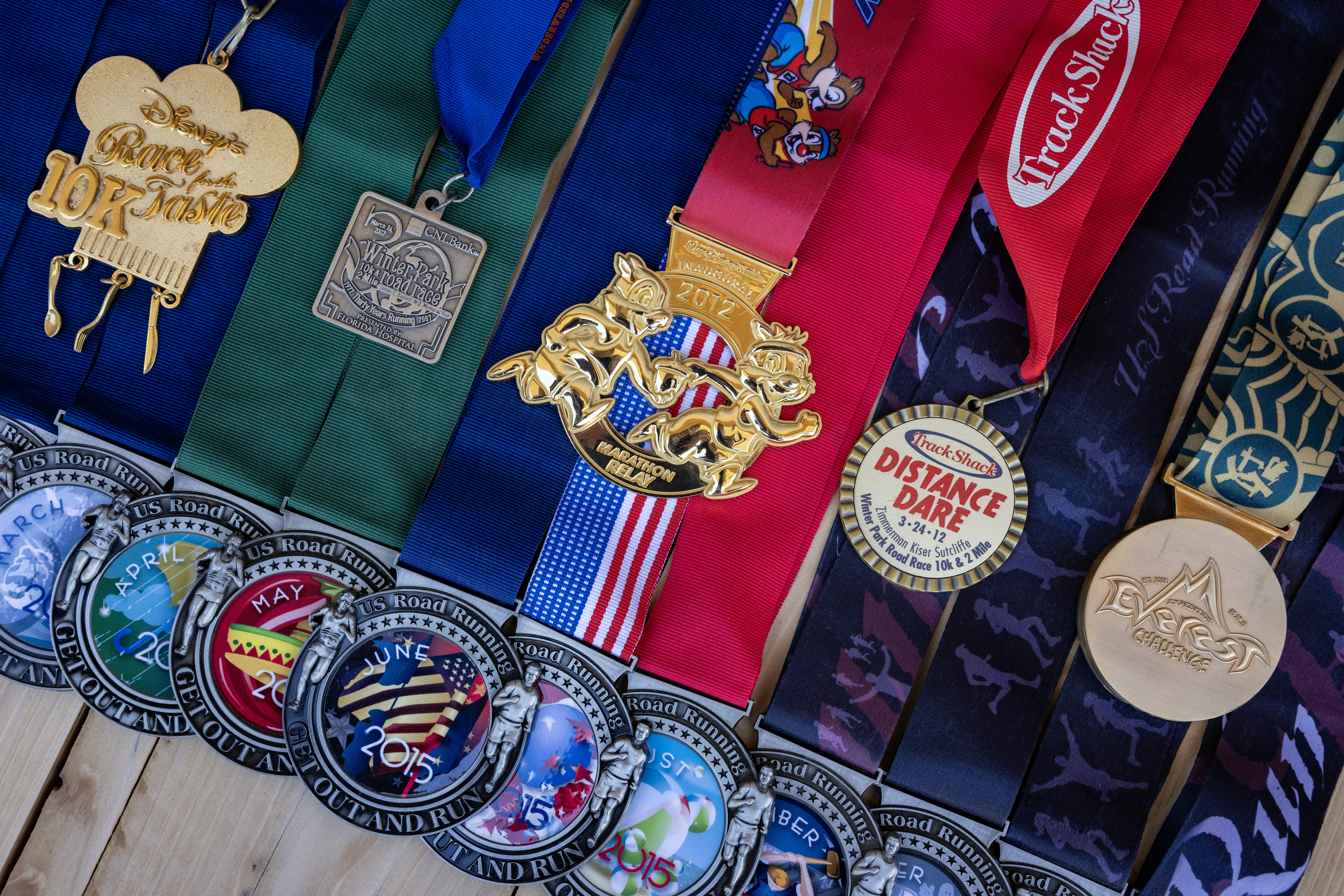 Collection of various medals with colorful ribbons