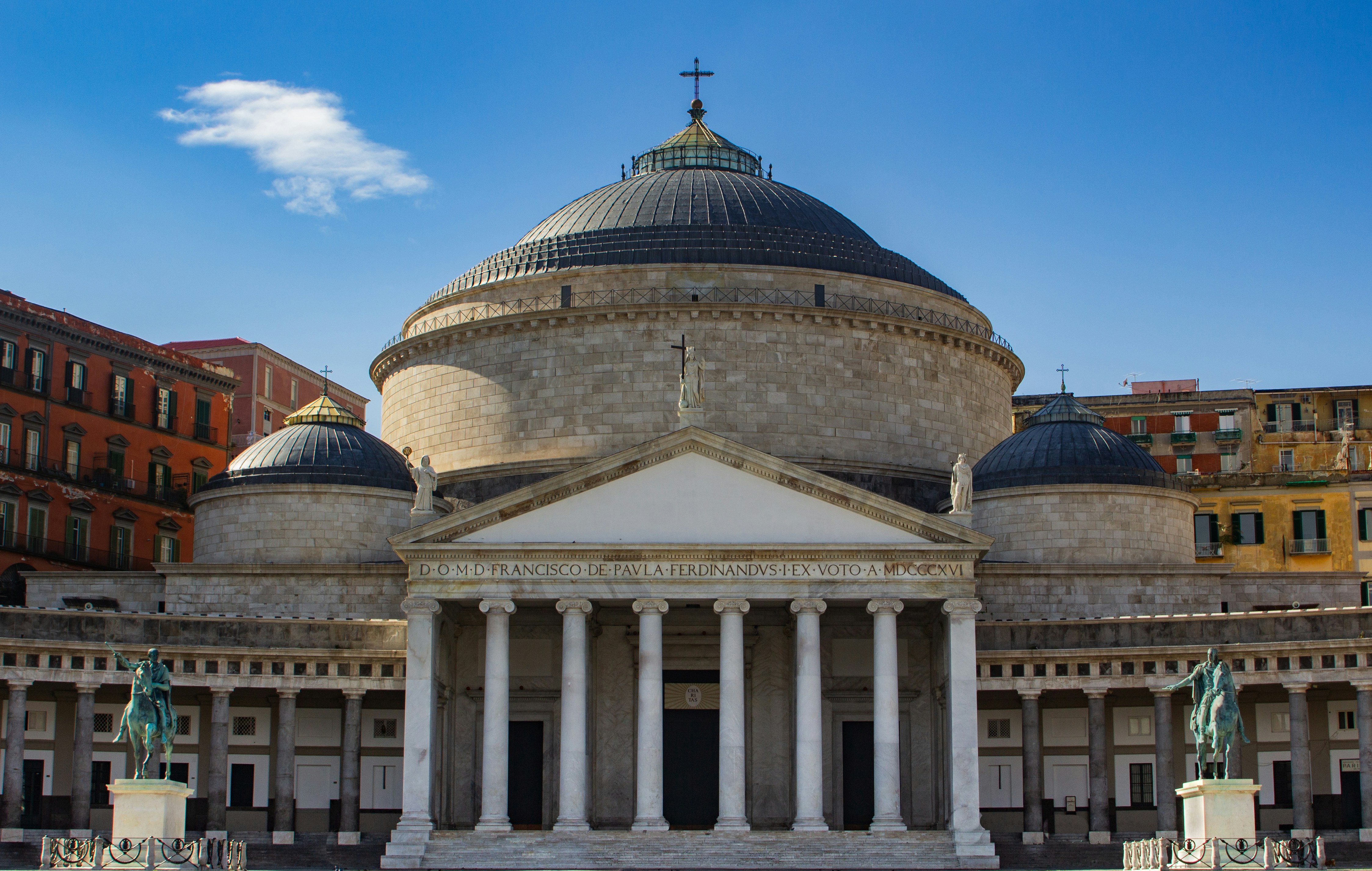 Grand historic building with a large dome and columns.