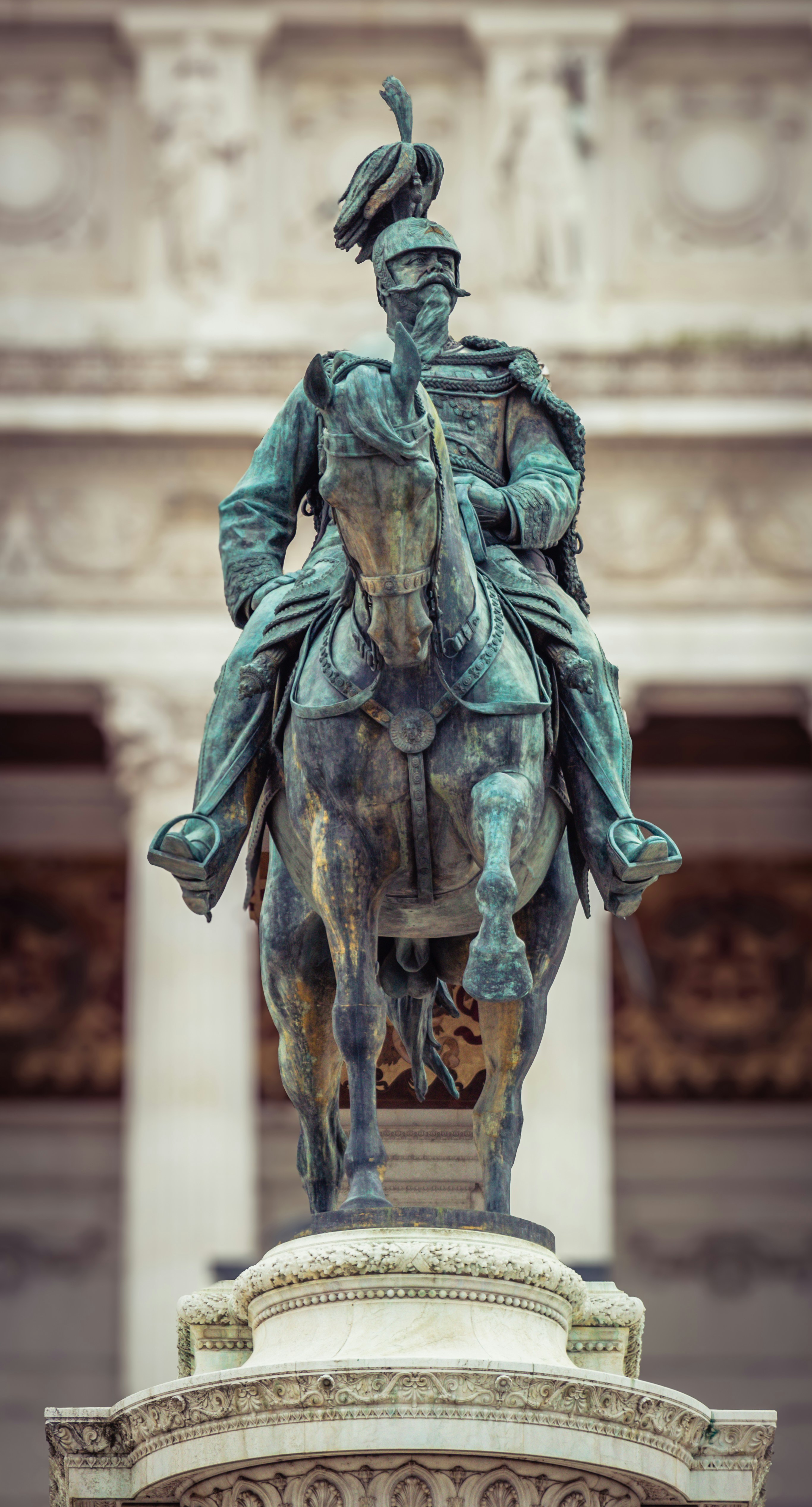 Bronze equestrian statue of a man in uniform.