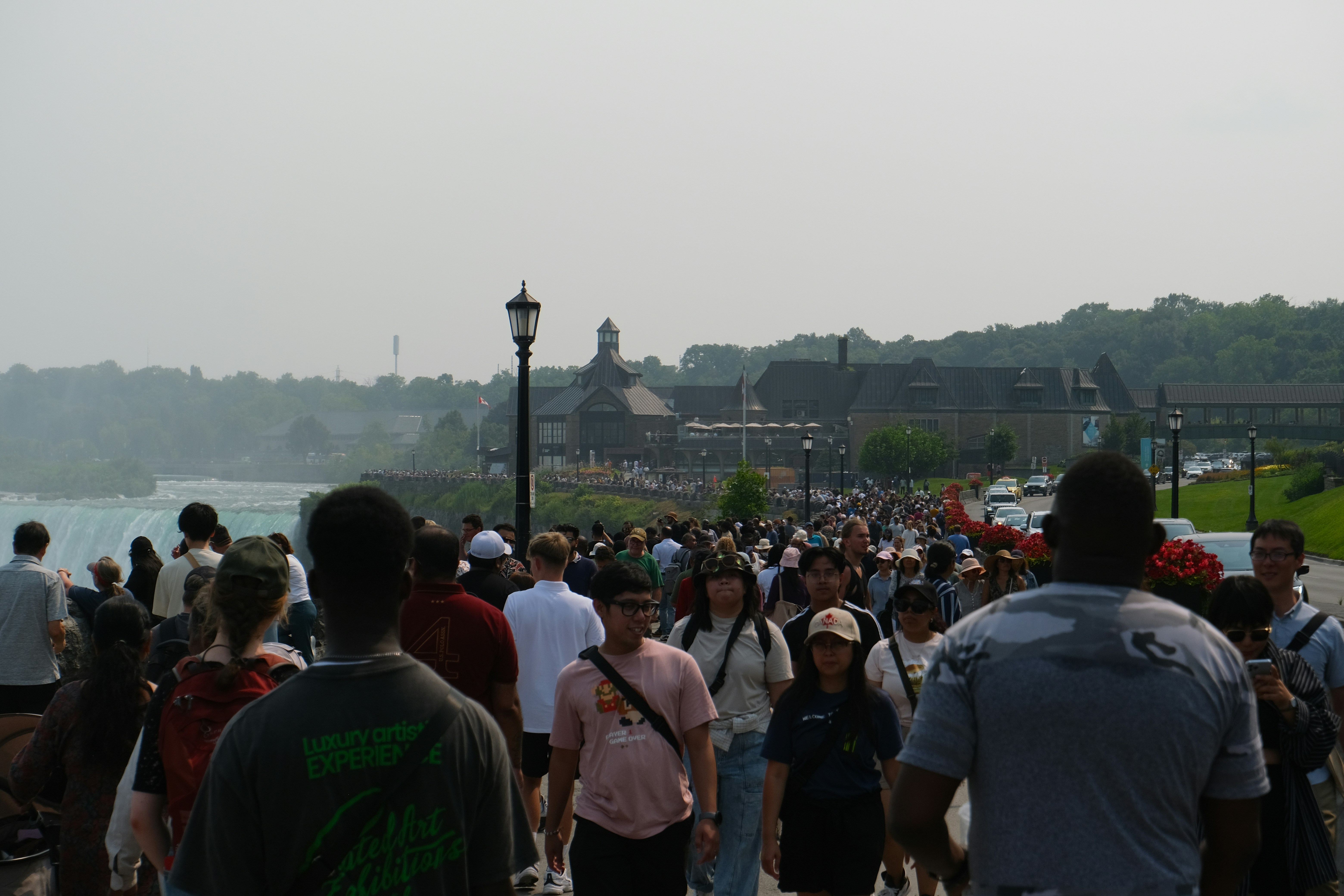 people enjoying the Detroit Riverwalk - downtown detroit housing