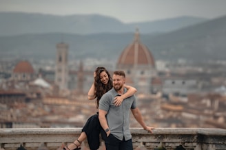 Couple embracing with florence cityscape background