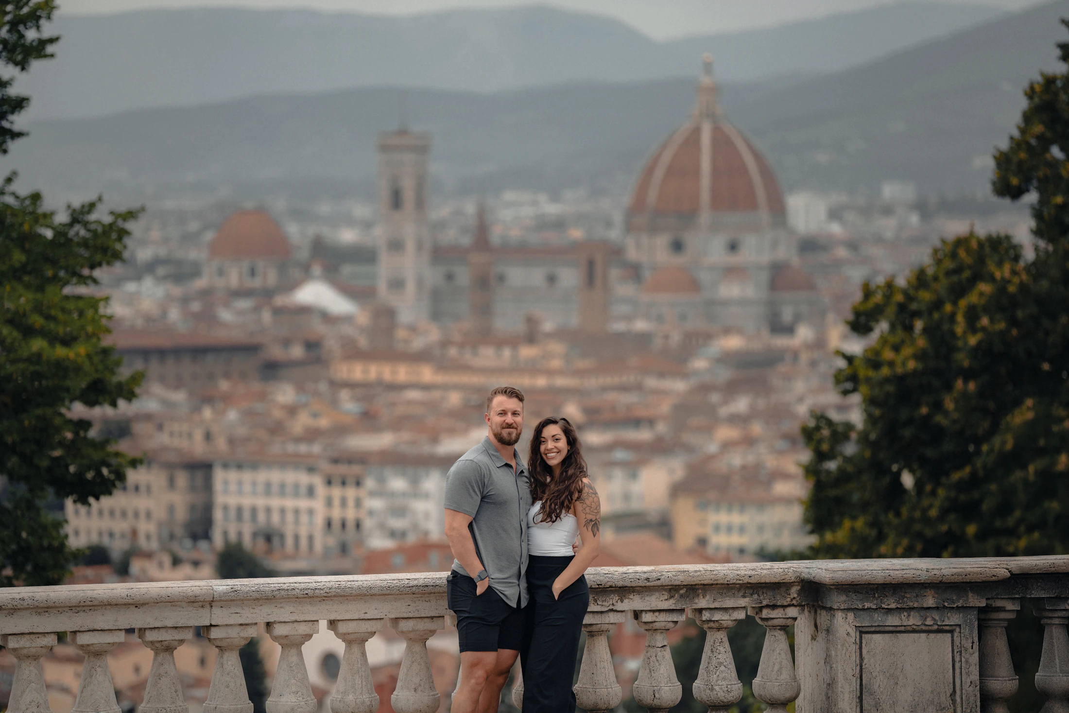Sofia and James on a terrace above the rooftops of Florence